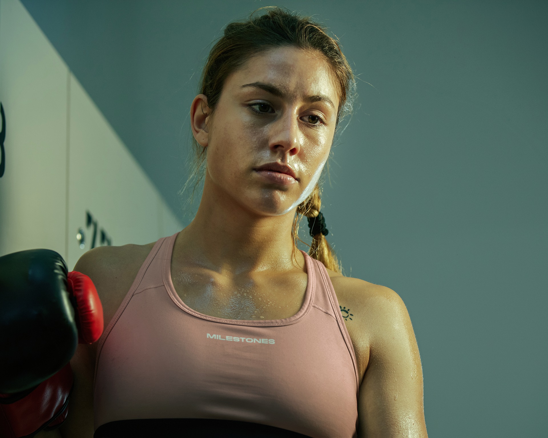 sports-bra-mockup-of-a-serious-athletic-woman-posing-after-boxing-training-m31543-r-el2