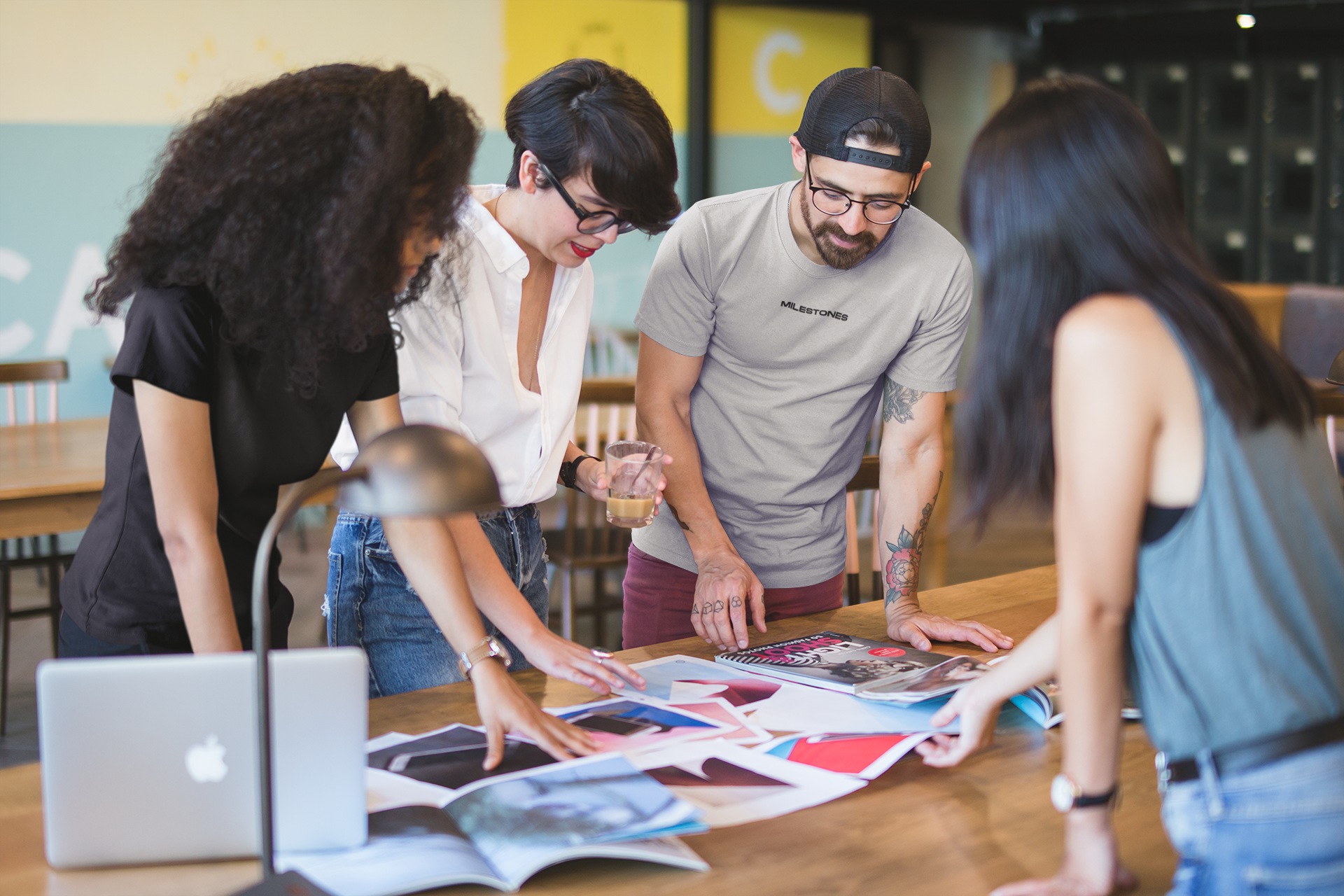 team-of-coworkers-wearing-round-neck-tees-mockup-while-brainstorming-a20434